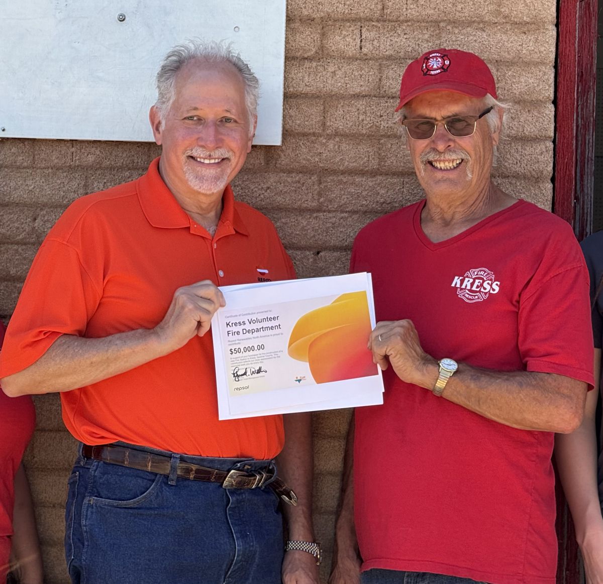 City of Kress Vol Fire Dept Chief David Hughes  receiving donation from Repsol Renewables North America for $50,000.00.